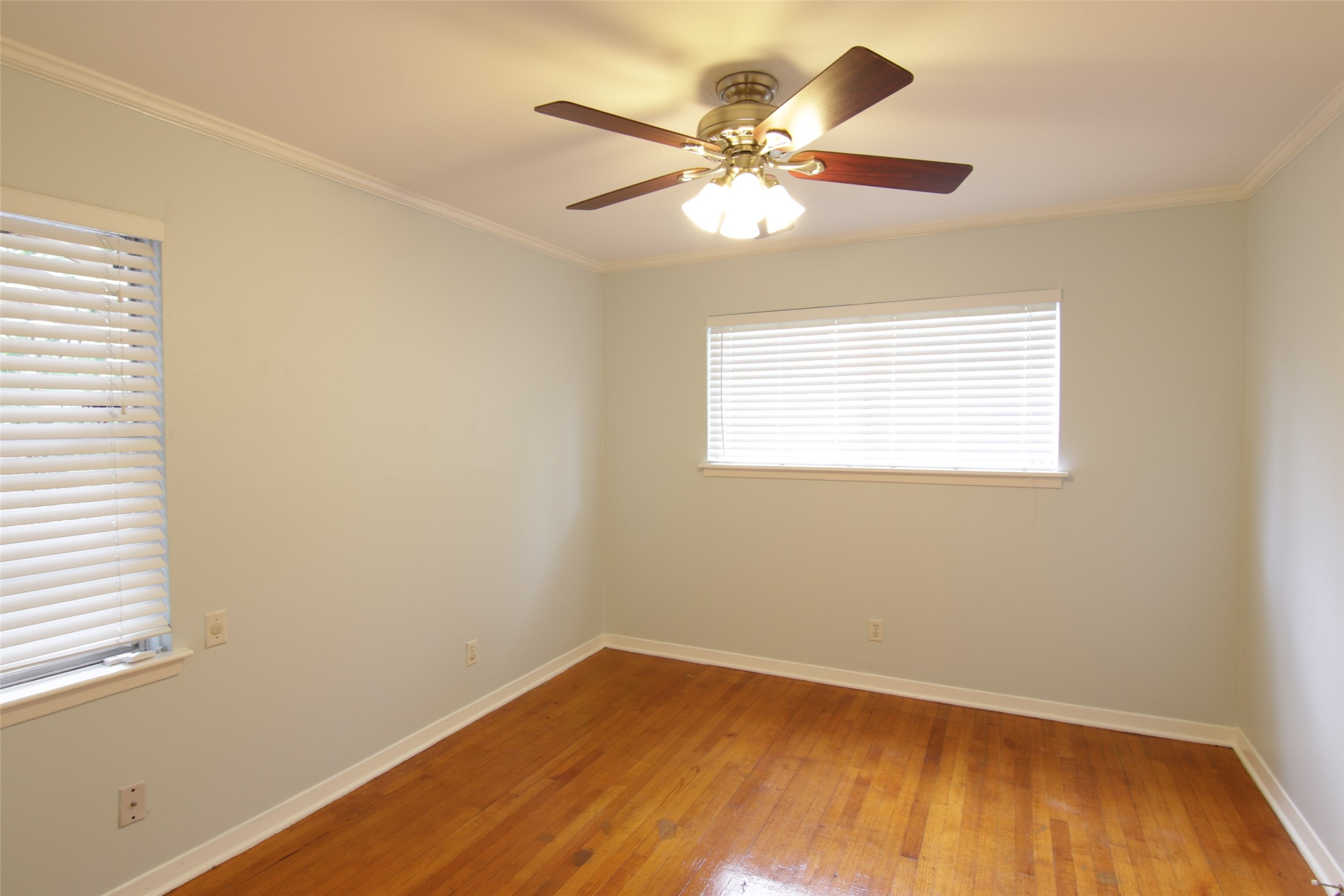 7030 Sharpview Drive Houston, TX 77074 - Photo 14 of 20 a view of a room with wooden floor and a window