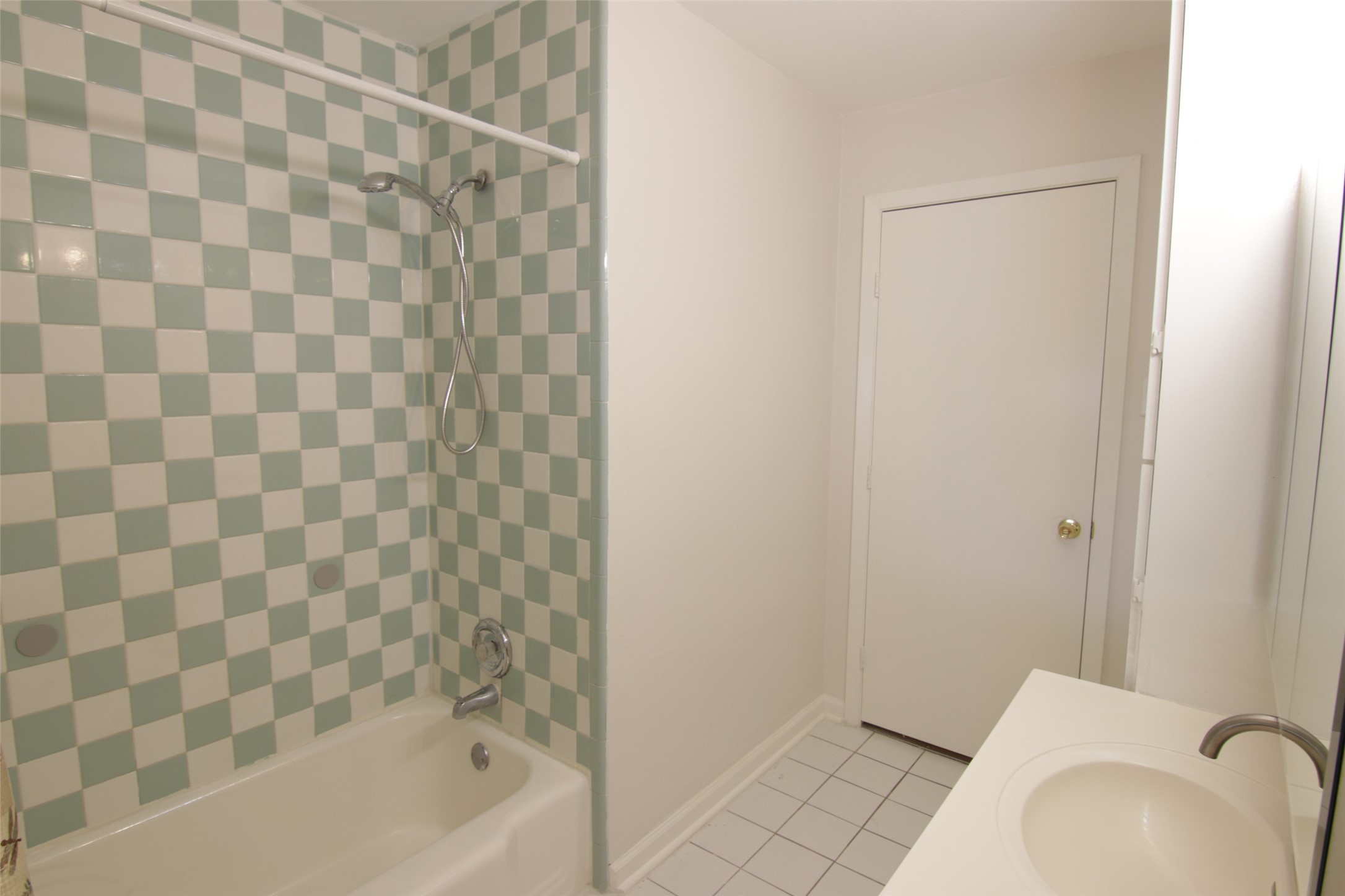 7030 Sharpview Drive Houston, TX 77074 - Photo 15 of 20 a bathroom with a bathtub and a sink