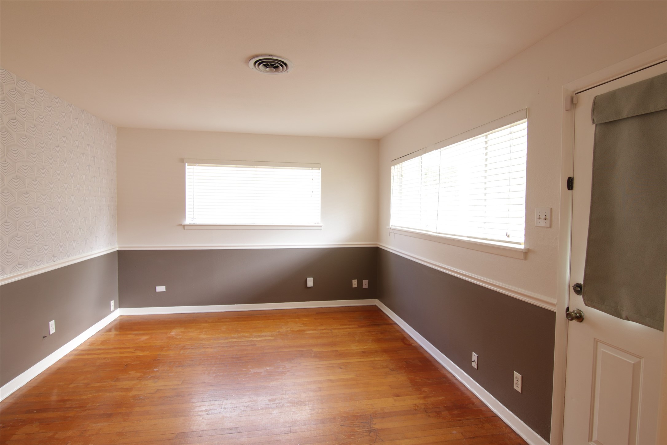 7030 Sharpview Drive Houston, TX 77074 - Photo 5 of 20 a view of an empty room with a window