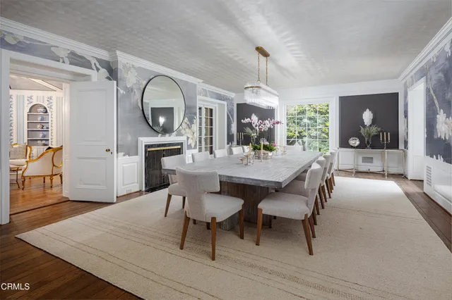 a kitchen with stainless steel appliances granite countertop a kitchen island a stove and a sink