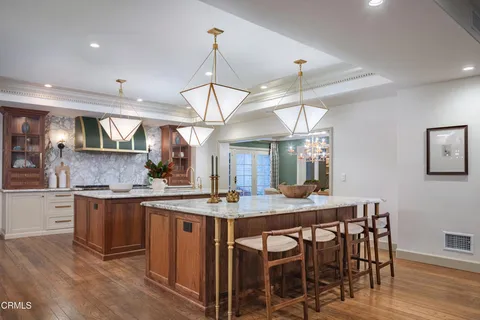 a living room with furniture and a book shelf