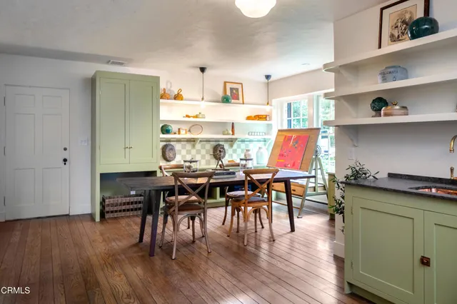 a view of a bathroom with a sink and a mirror