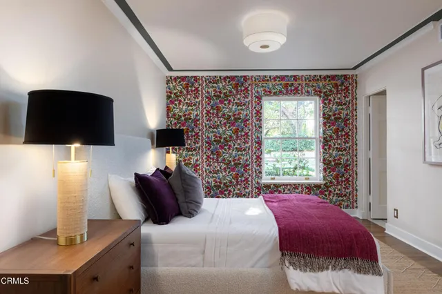 a living room with furniture or couch and a potted plant