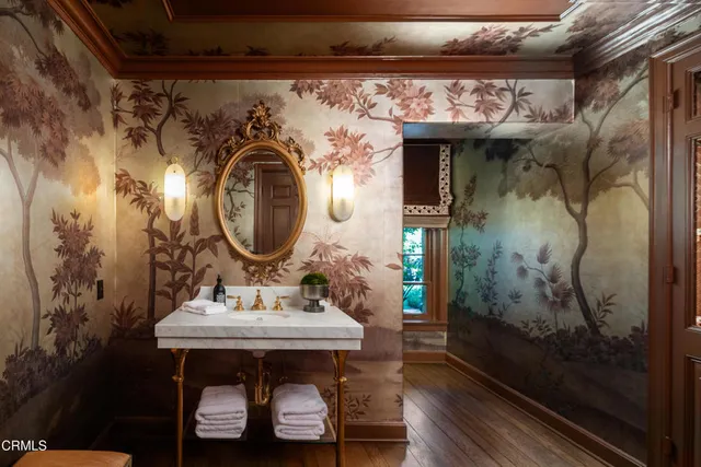 a living room with furniture and a large window with wooden floor