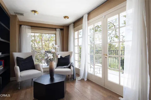 a bedroom with a bed and a fireplace