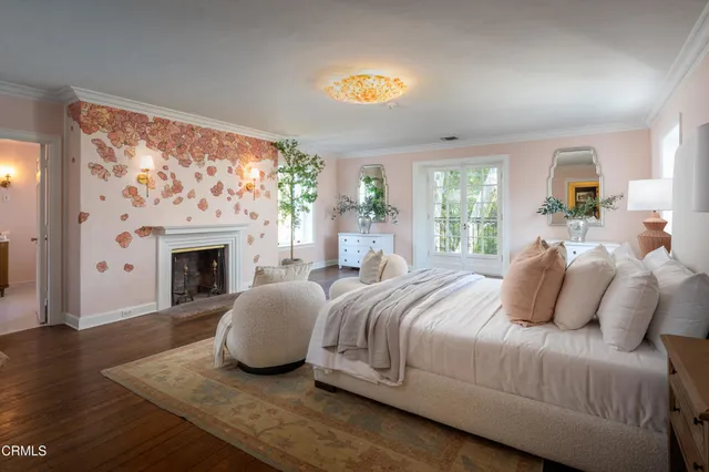 a view of a swimming pool with couches and lounge chairs