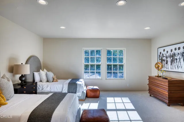 a view of a balcony with two chairs and a table