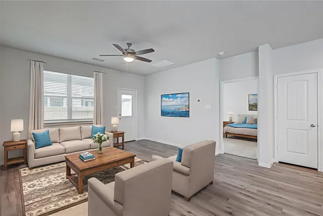 a living room with furniture and a window
