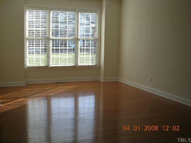 2509 St Paul's Square Raleigh, NC 27614 - Photo 2 of 12 Sunny living room has hardwoods and is open to dining room. Other