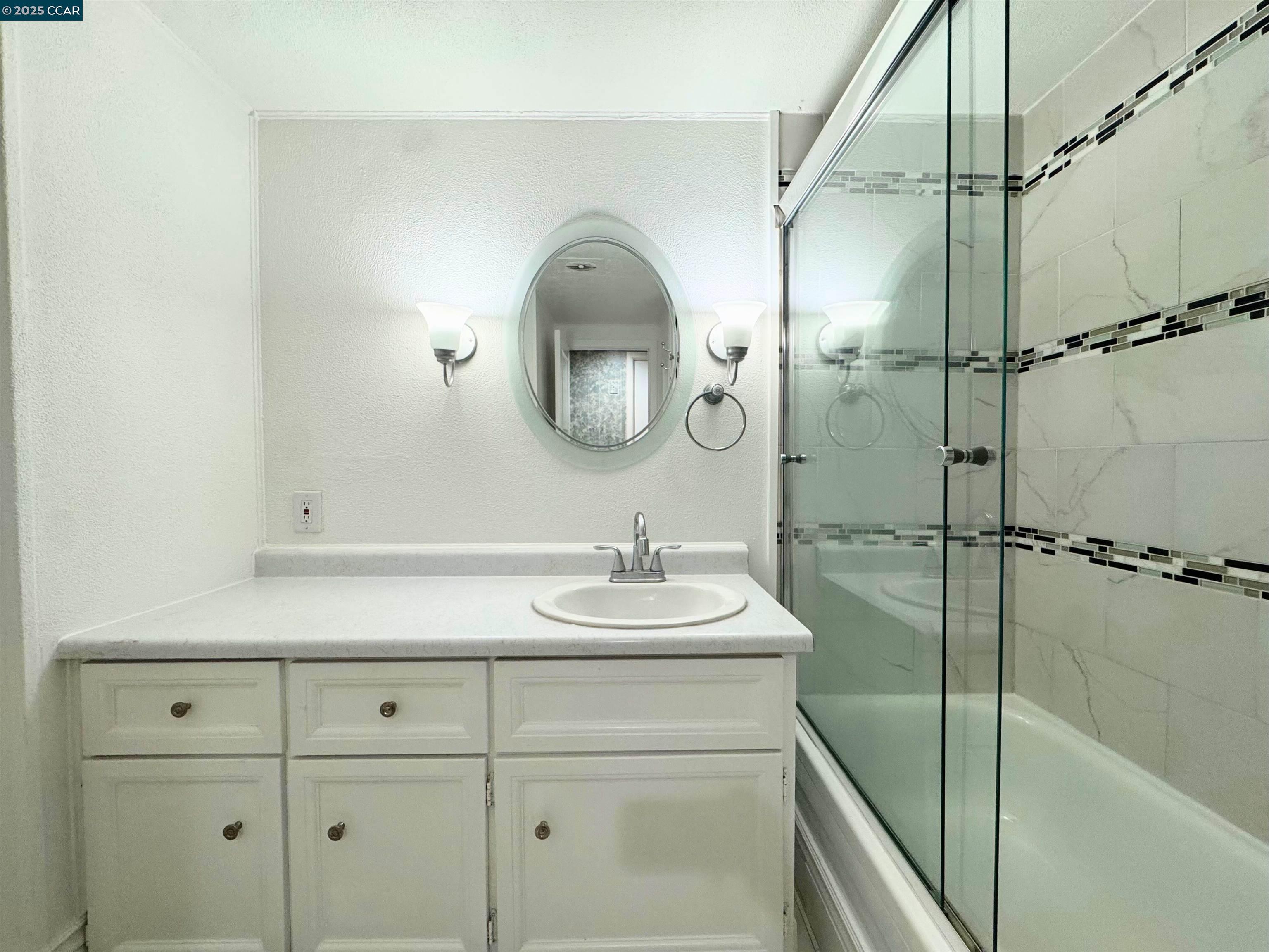 55 Pacifica Avenue, Unit 110 Bay Point, CA 94565 - Photo 13 of 20 a bathroom with a sink and mirror
