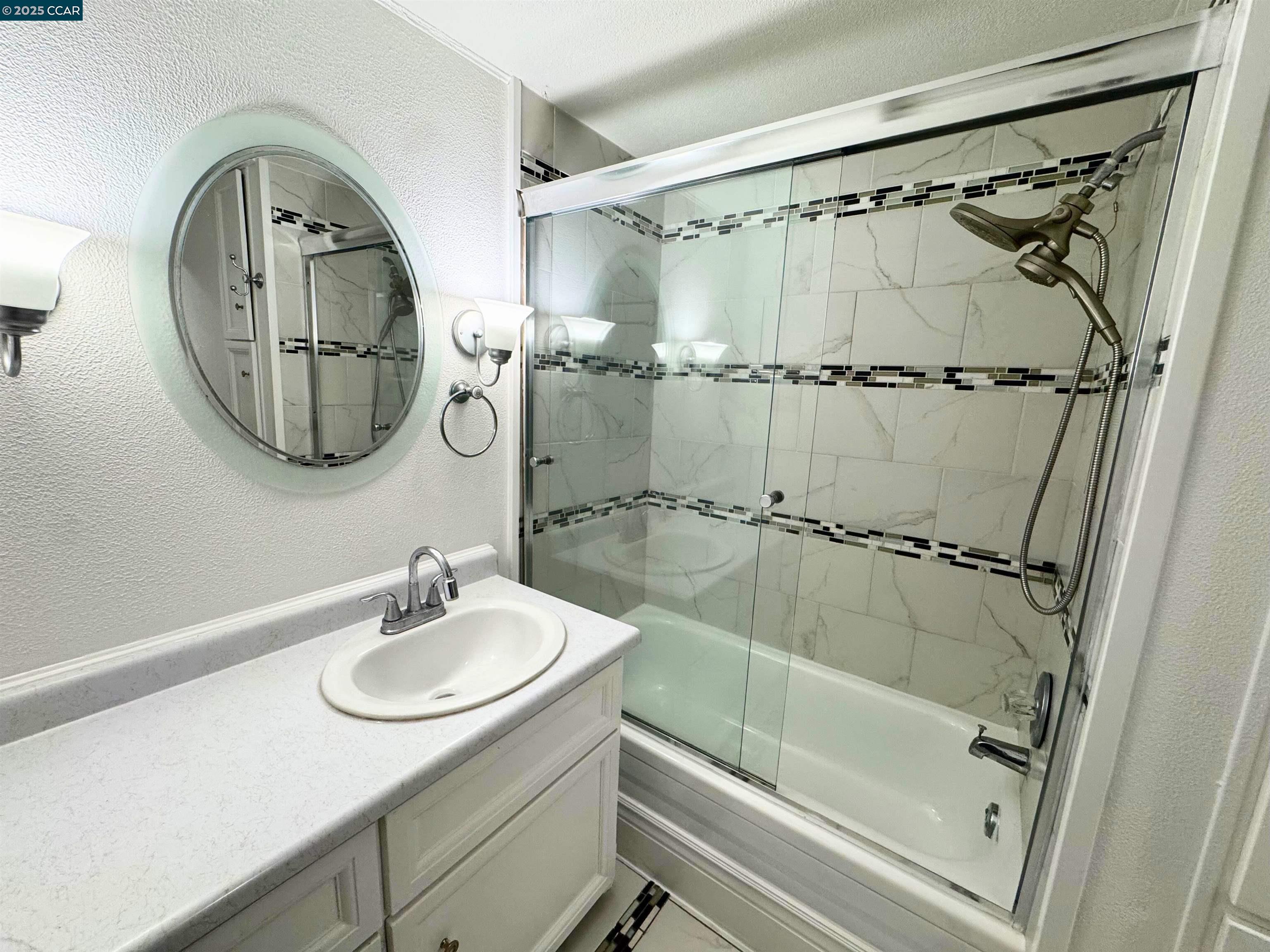 55 Pacifica Avenue, Unit 110 Bay Point, CA 94565 - Photo 14 of 20 a bathroom with a sink and a mirror