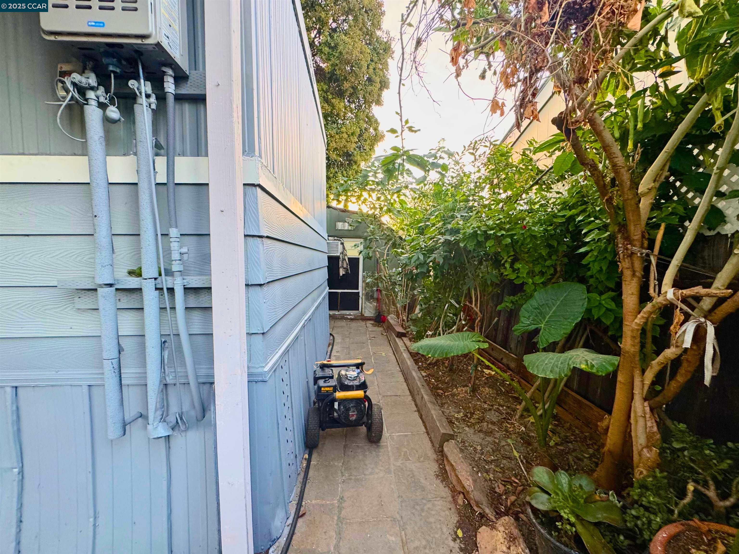 55 Pacifica Avenue, Unit 110 Bay Point, CA 94565 - Photo 19 of 20 a view of a pathway of a house with wooden fence