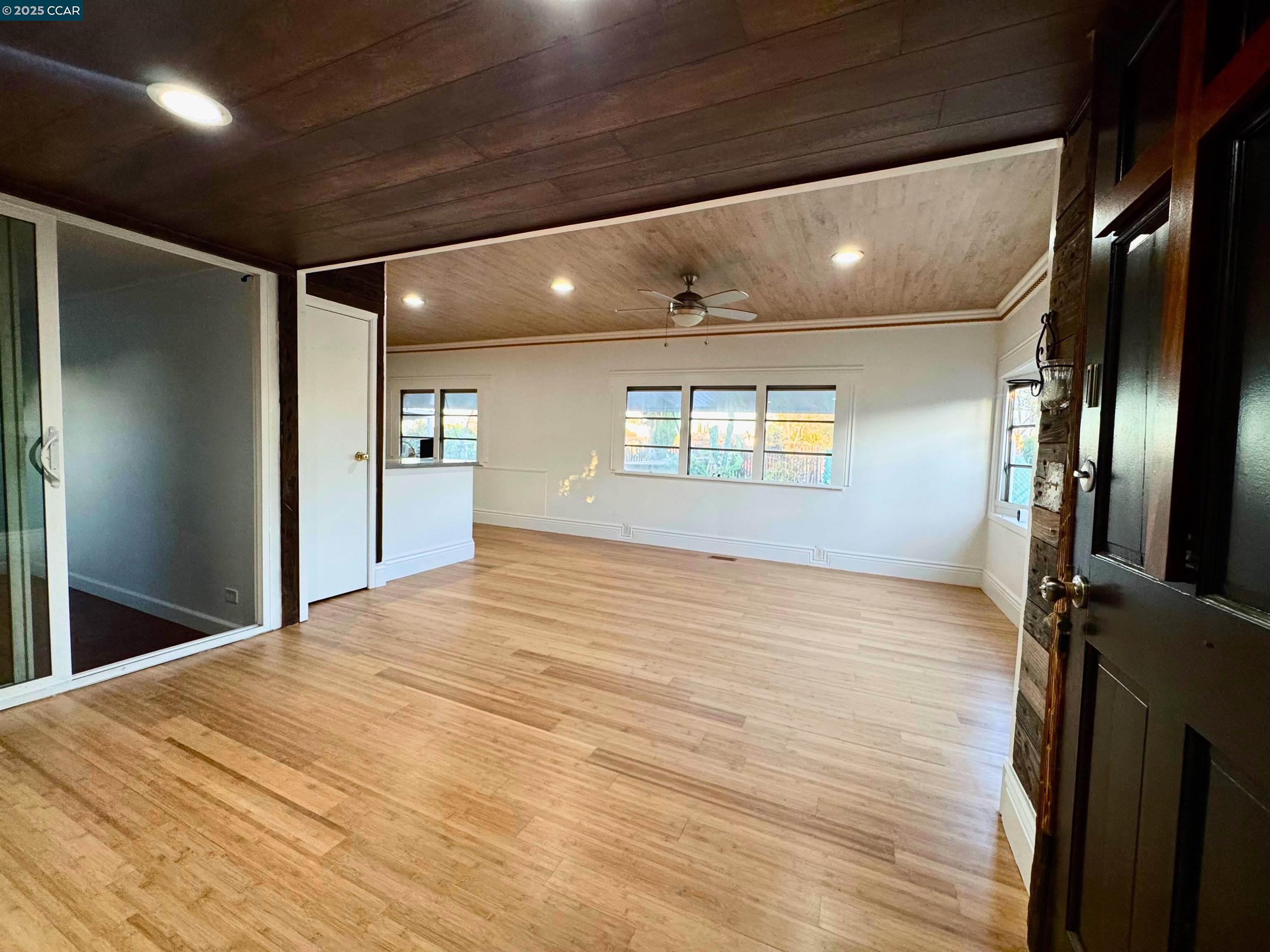 55 Pacifica Avenue, Unit 110 Bay Point, CA 94565 - Photo 3 of 20 a view of empty room with wooden floor