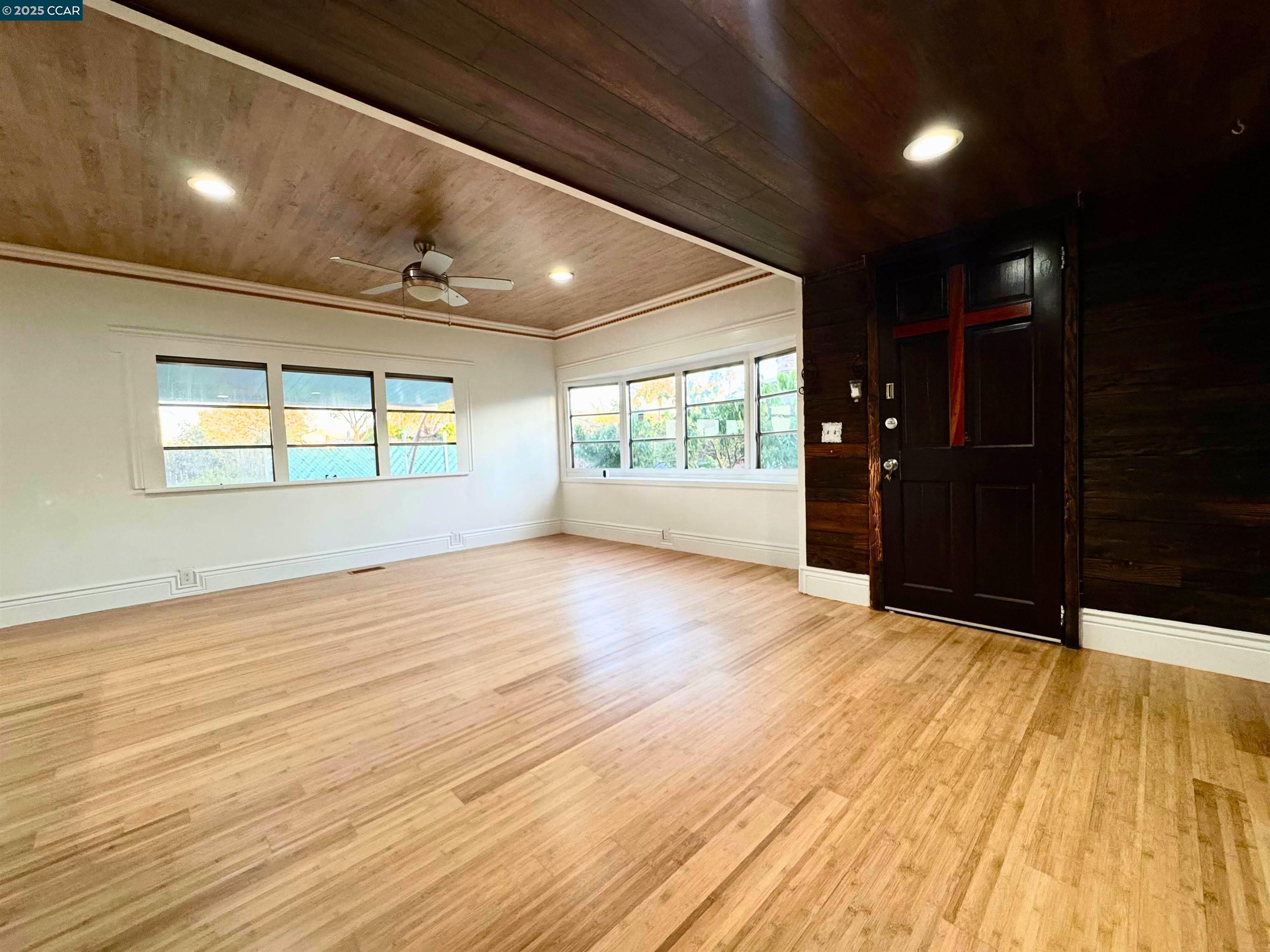 55 Pacifica Avenue, Unit 110 Bay Point, CA 94565 - Photo 4 of 20 a view of an empty room with wooden floor and a window