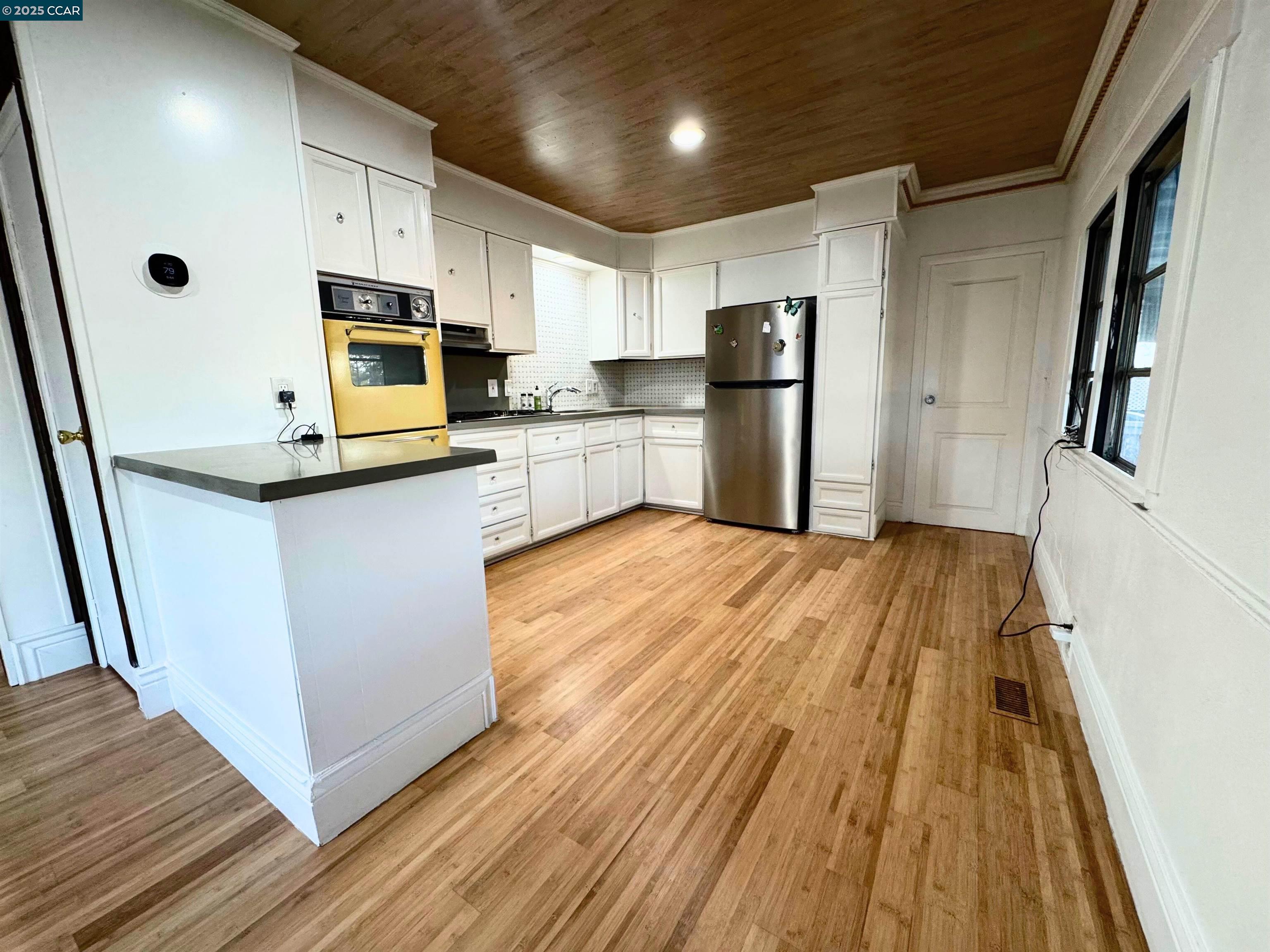 55 Pacifica Avenue, Unit 110 Bay Point, CA 94565 - Photo 7 of 20 a kitchen with stainless steel appliances a refrigerator sink and microwave