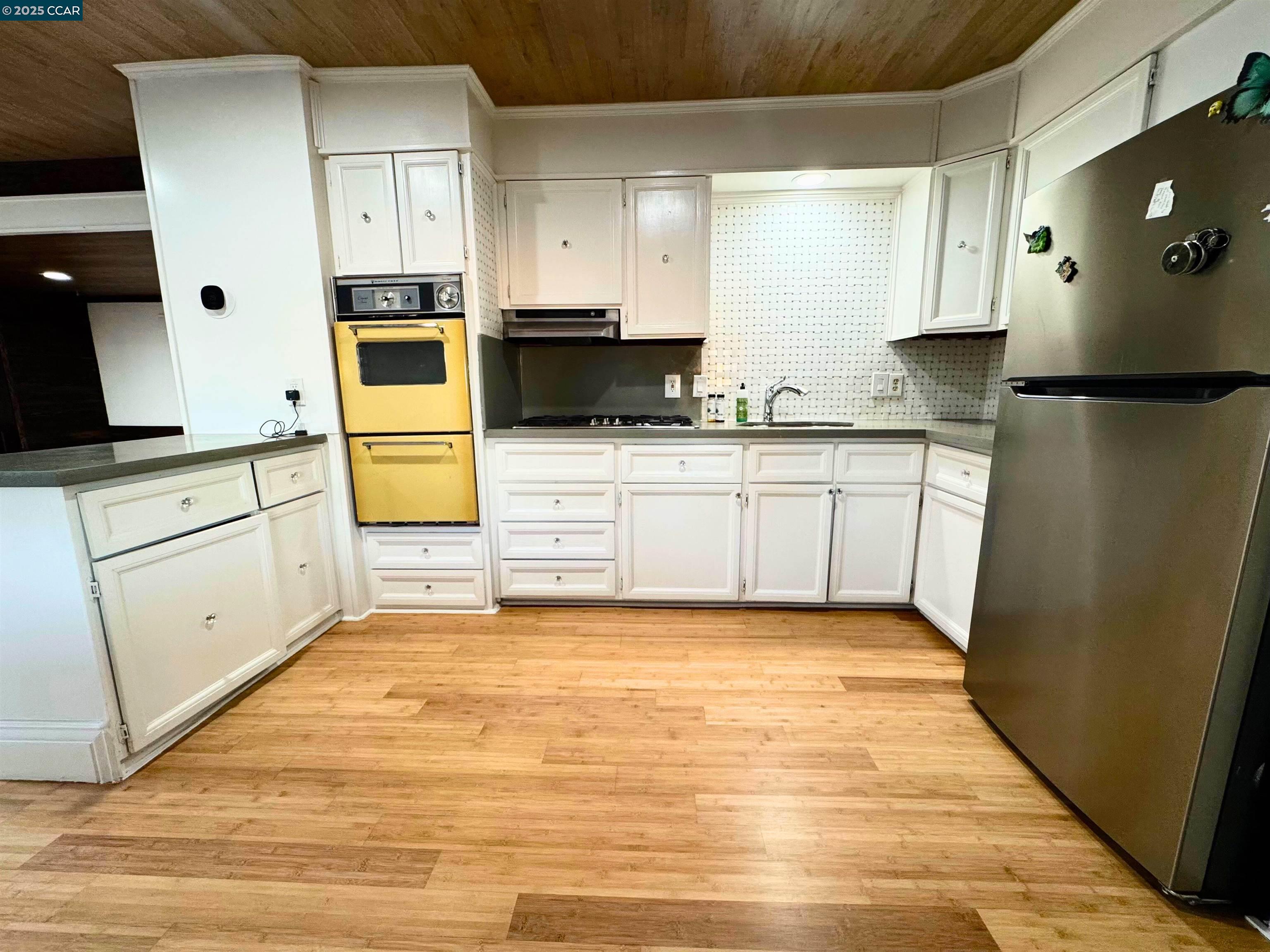 55 Pacifica Avenue, Unit 110 Bay Point, CA 94565 - Photo 8 of 20 a kitchen with stainless steel appliances a refrigerator sink and microwave