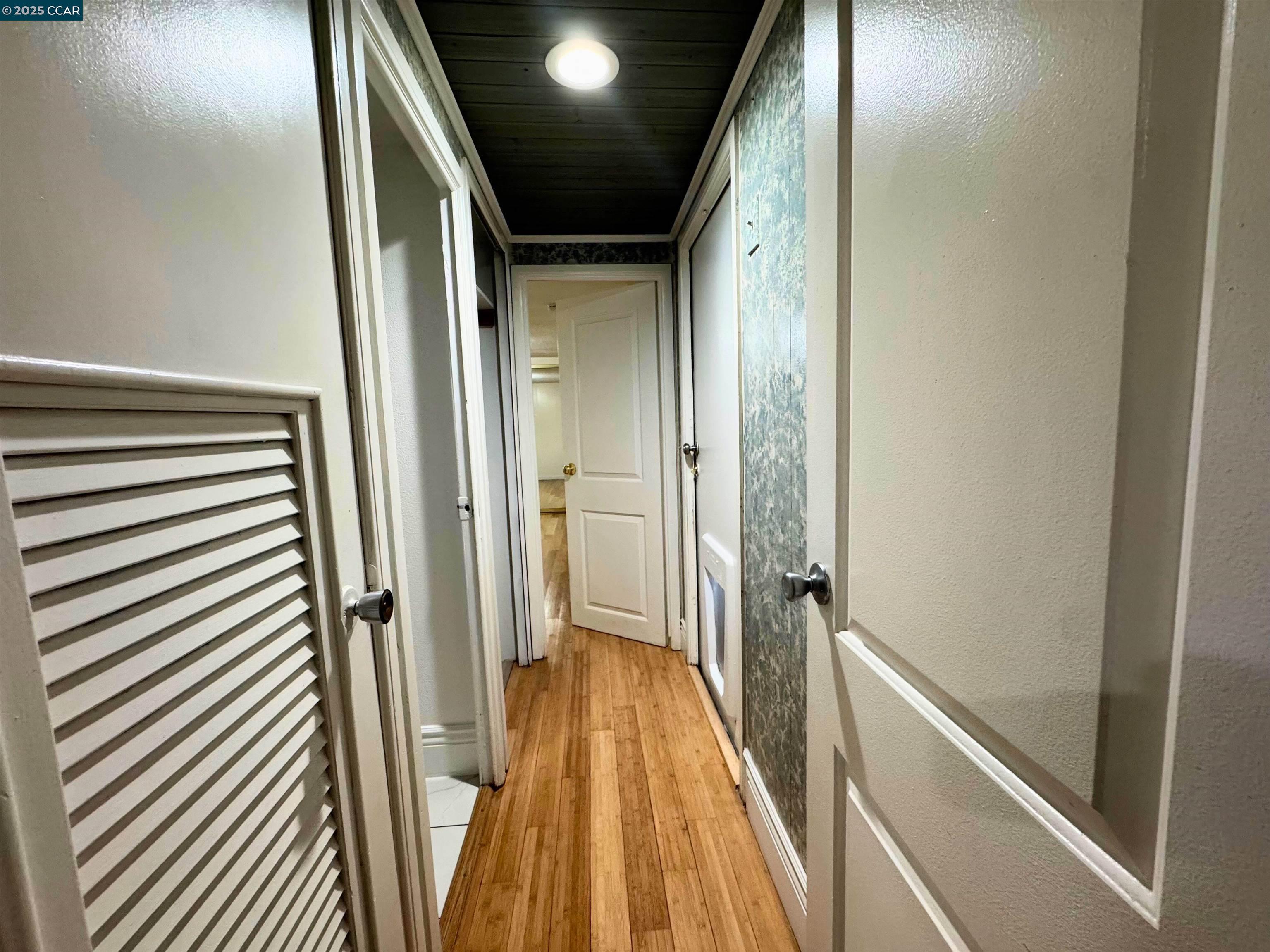 55 Pacifica Avenue, Unit 110 Bay Point, CA 94565 - Photo 10 of 20 a view of a hallway with wooden floor and staircase