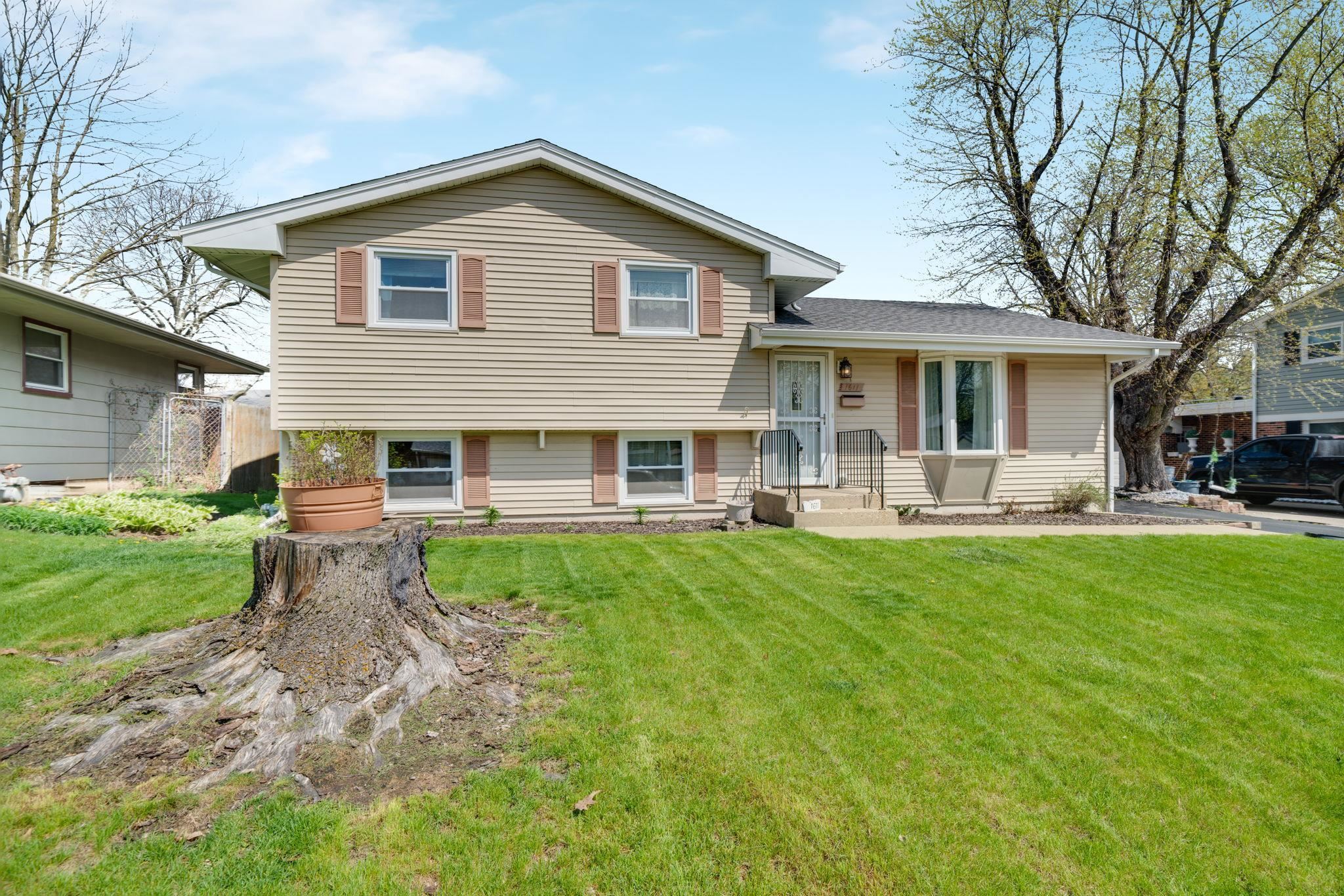 1611 Notre Dame Road Rockford, IL 61103 - Photo 1 of 33 a front view of house with yard and green space