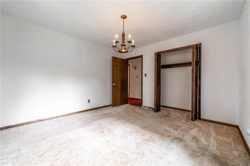 144 Cooper Road Cabot, PA 16023 - Photo 14 of 25 a view of a chandelier in big room and a chandelier