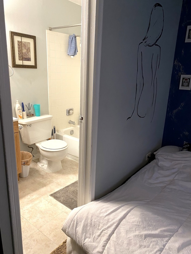 2038 North Rand Road, Unit 212 Palatine, IL 60074 - Photo 19 of 27 a bathroom with a granite countertop sink and a toilet