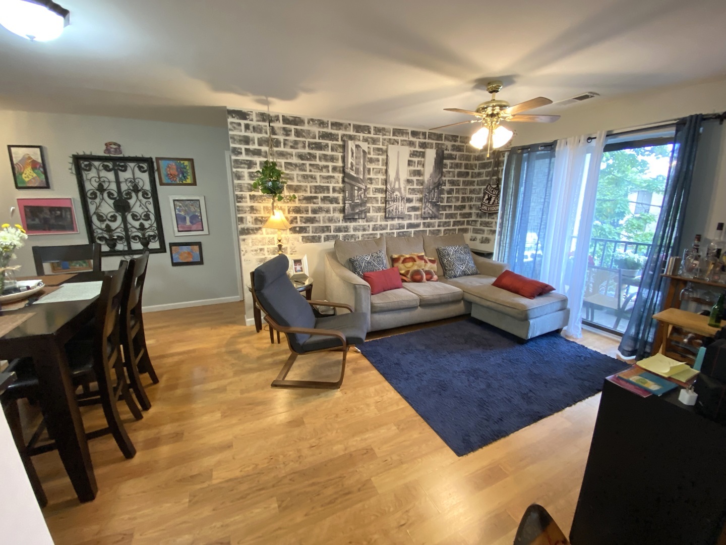 2038 North Rand Road, Unit 212 Palatine, IL 60074 - Photo 3 of 27 a living room with furniture and a large window