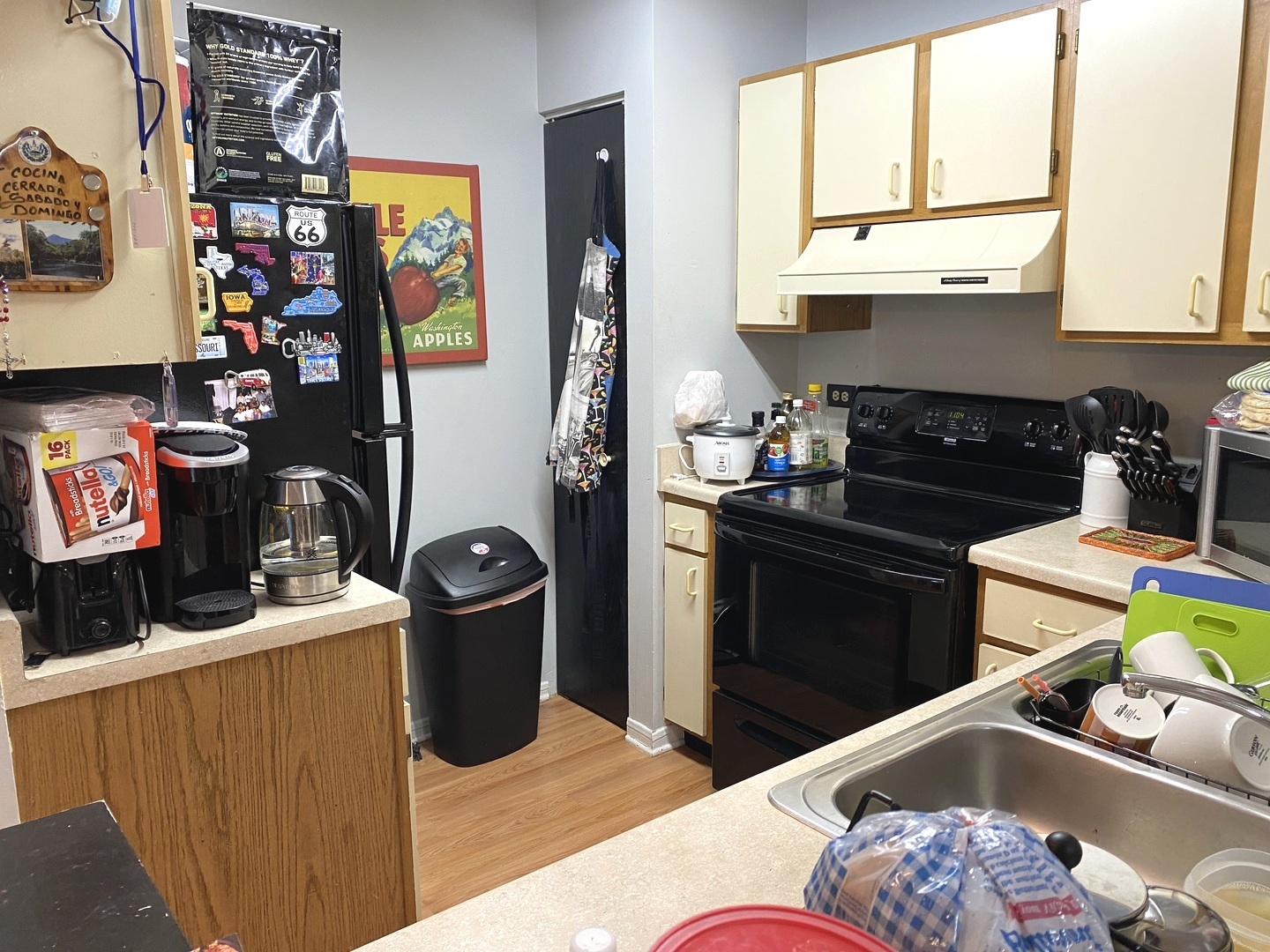 2038 North Rand Road, Unit 212 Palatine, IL 60074 - Photo 7 of 27 a kitchen with a stove a refrigerator and a sink