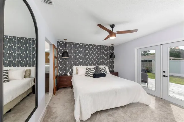 a bedroom with a large bed and a couch