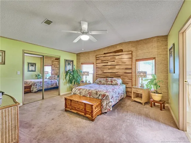 a bedroom with a bed and a couch