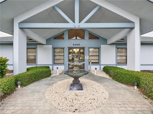 a view of a swimming pool with outdoor seating