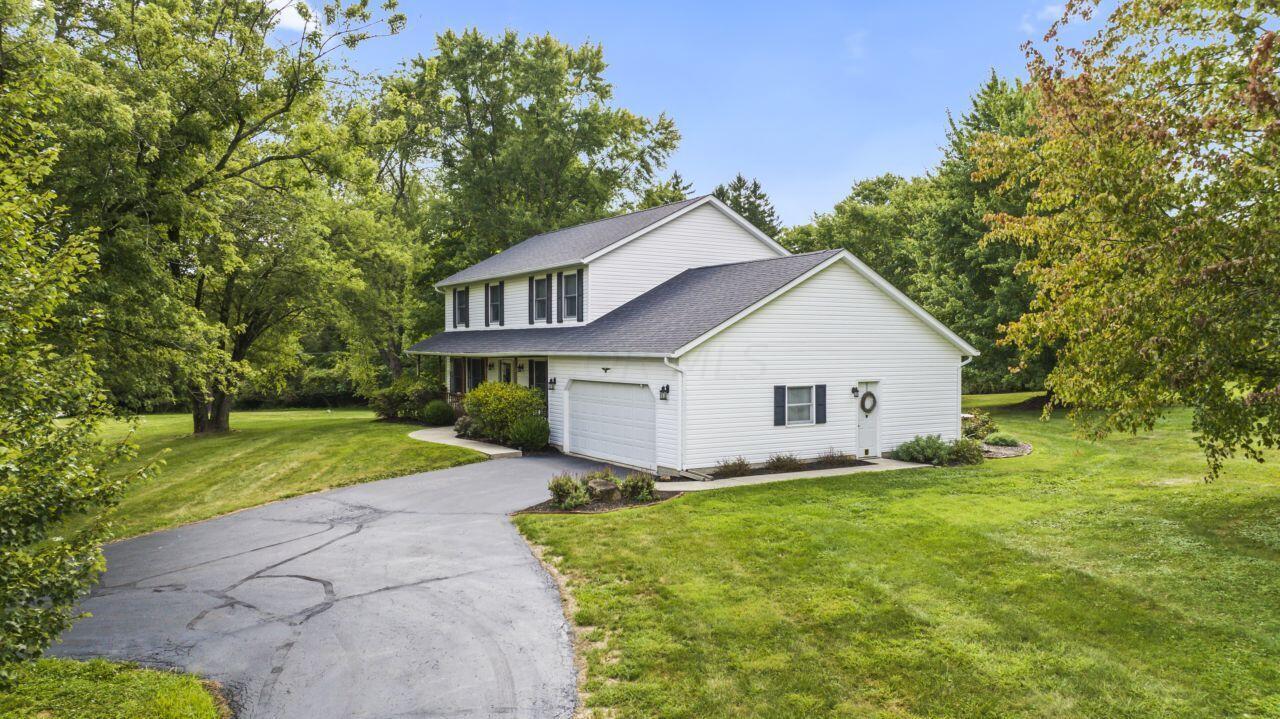 1550 Swans Road Northeast Newark, OH 43055 - Photo 2 of 65 Driveway and Side of Home