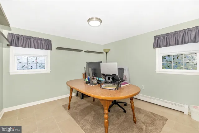 a room with furniture and a flat screen tv