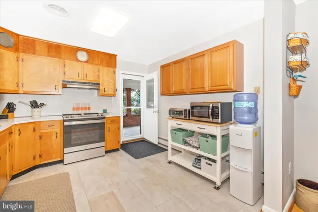 a very nice looking room with kitchen island furniture and a large window