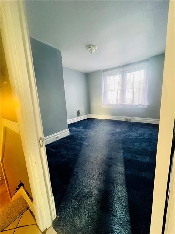 1816 Monroe Street Pittsburgh, PA 15218 - Photo 11 of 21 an empty room with wooden floor and windows