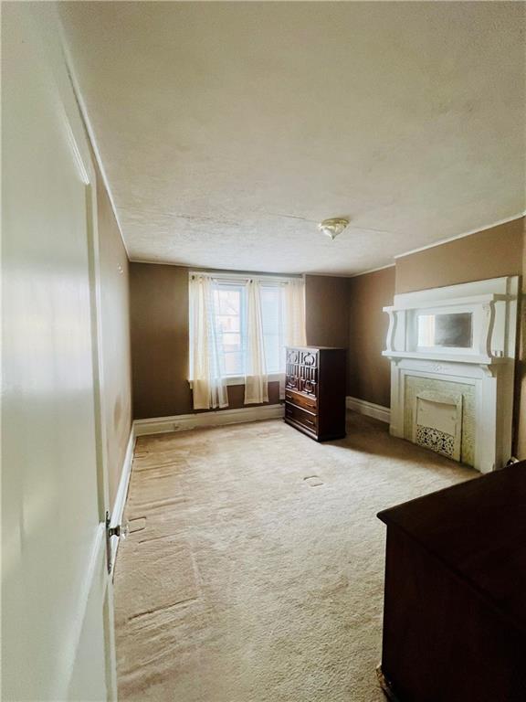 1816 Monroe Street Pittsburgh, PA 15218 - Photo 14 of 21 a living room with furniture and a flat screen tv