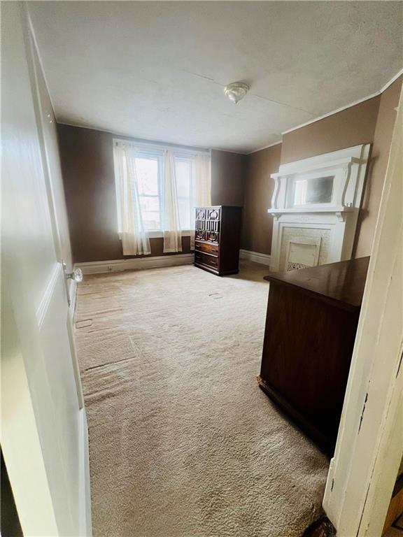 1816 Monroe Street Pittsburgh, PA 15218 - Photo 17 of 21 a view of a kitchen with furniture and wooden floor