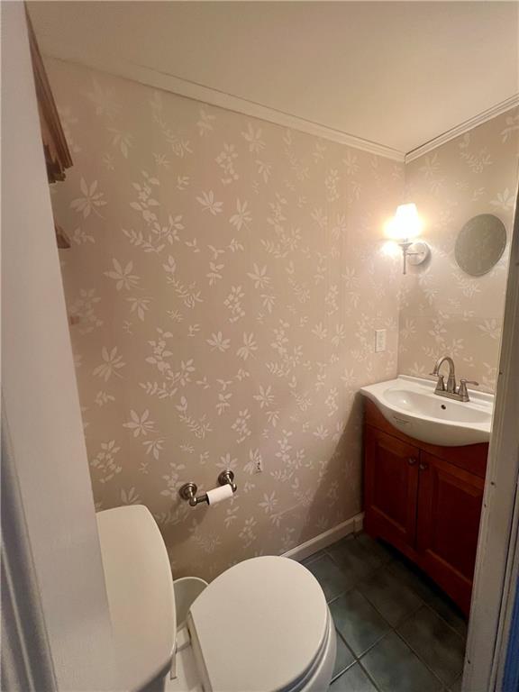 1816 Monroe Street Pittsburgh, PA 15218 - Photo 4 of 21 a bathroom with a sink a toilet and mirror