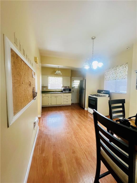 1816 Monroe Street Pittsburgh, PA 15218 - Photo 7 of 21 a view of a kitchen with a sink stainless steel appliances and cabinets
