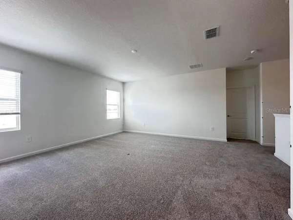 an empty room that has a window