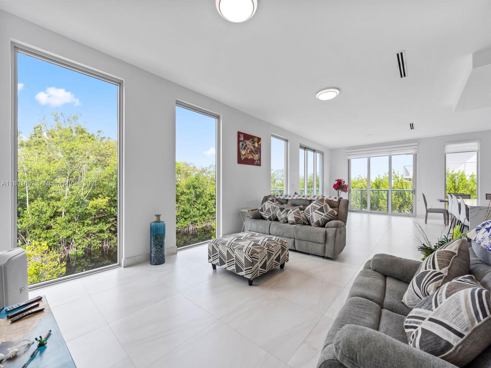 474 Bahia Honda Road Key Largo, FL 33037 - Photo 14 of 33 a living room with furniture and a large window