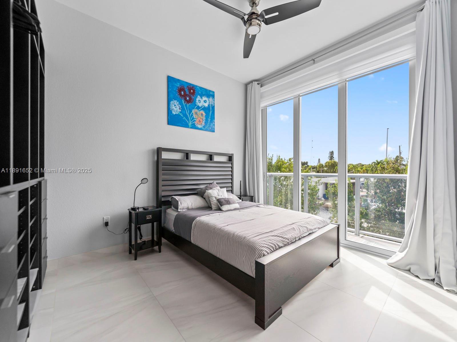 474 Bahia Honda Road Key Largo, FL 33037 - Photo 17 of 33 a bedroom with a bed and a window