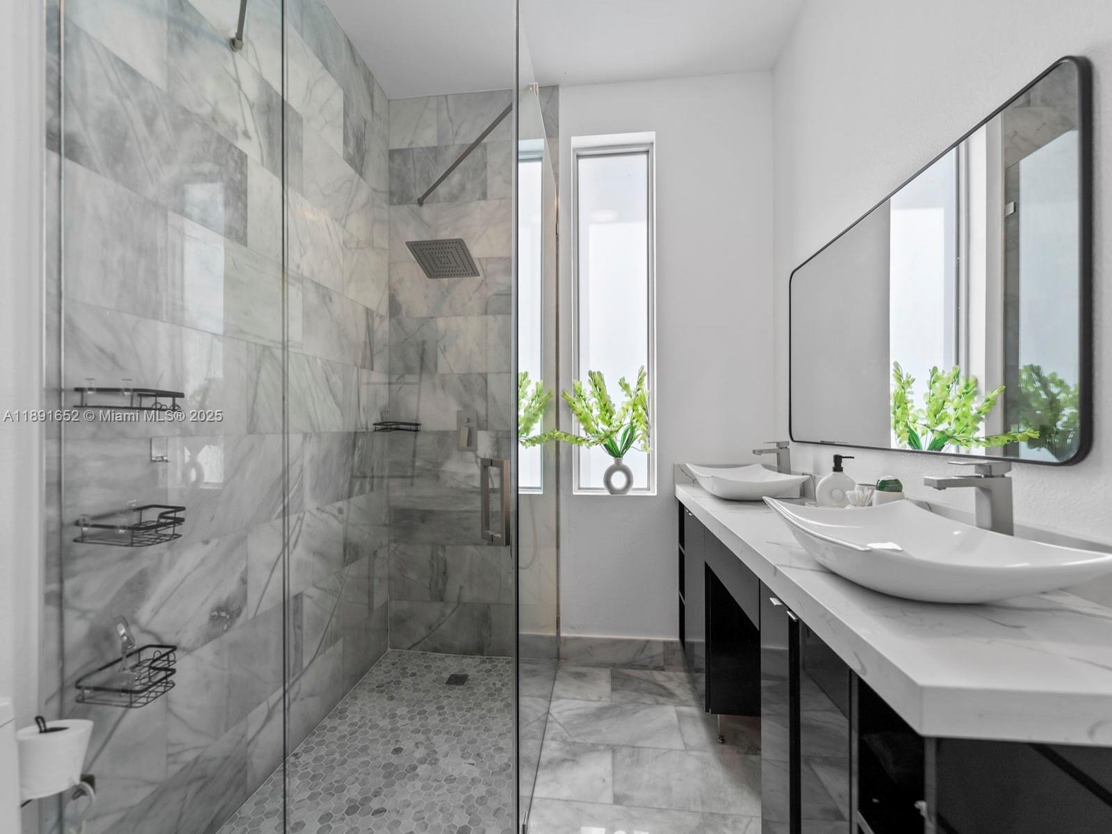 474 Bahia Honda Road Key Largo, FL 33037 - Photo 22 of 33 a bathroom with a granite countertop sink a mirror and shower