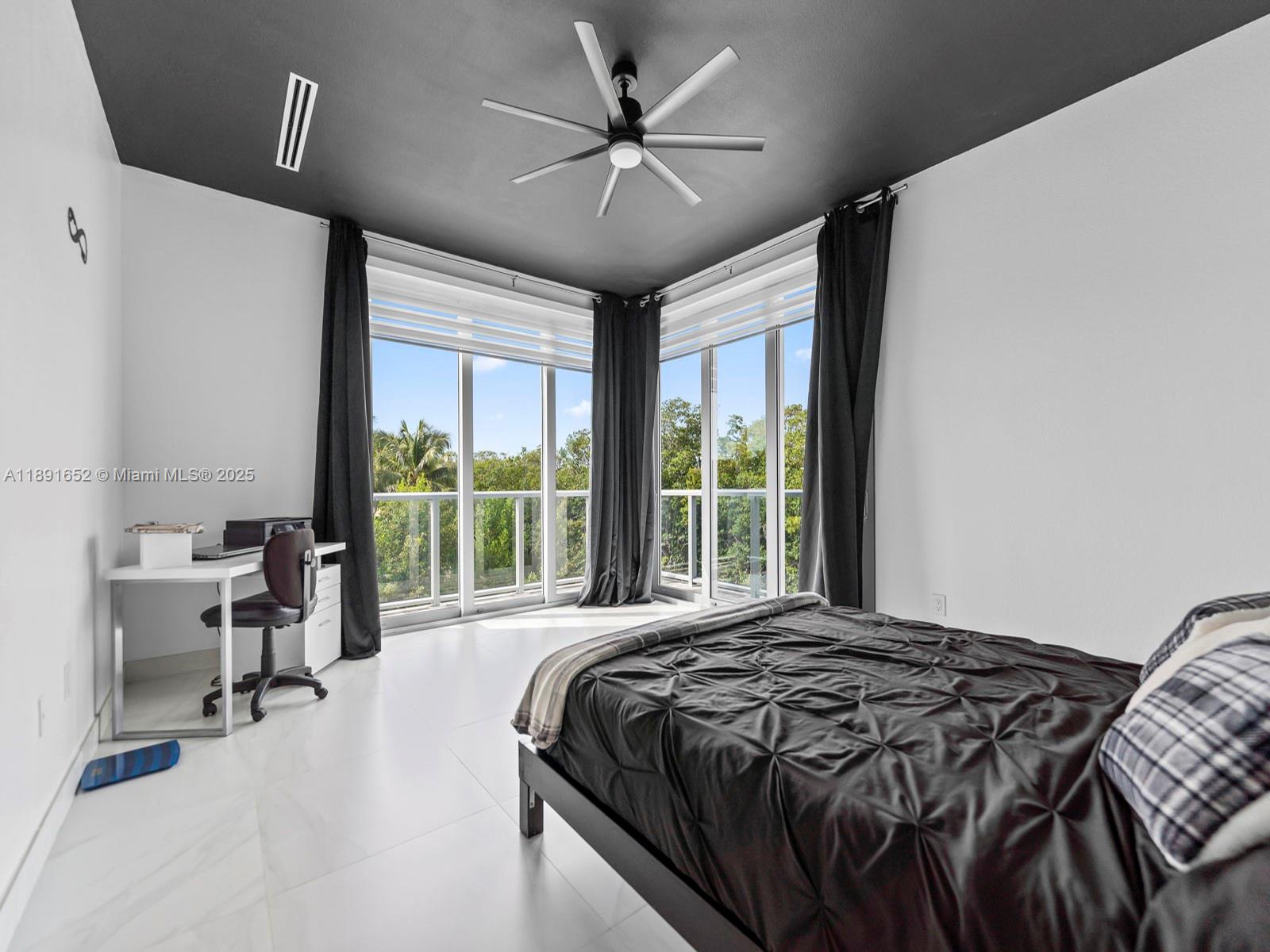 474 Bahia Honda Road Key Largo, FL 33037 - Photo 23 of 33 a large bed sitting in a bedroom next to a window