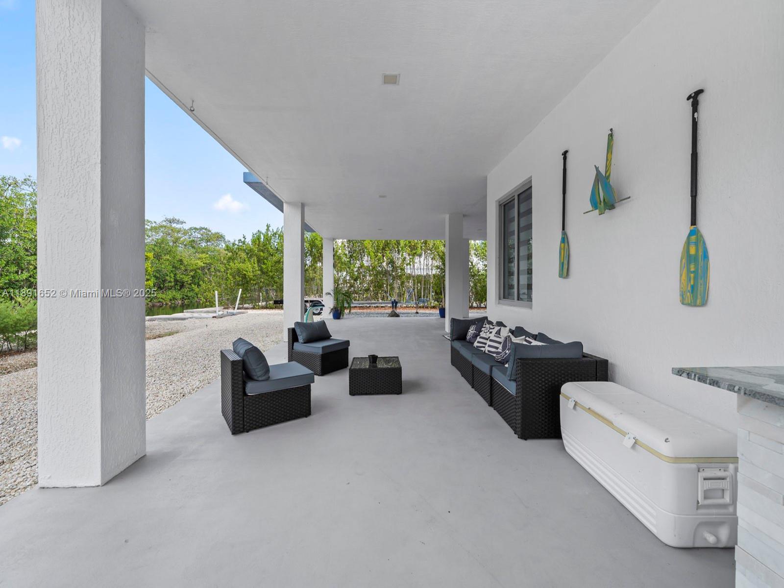 474 Bahia Honda Road Key Largo, FL 33037 - Photo 29 of 33 a living room with furniture and a large window