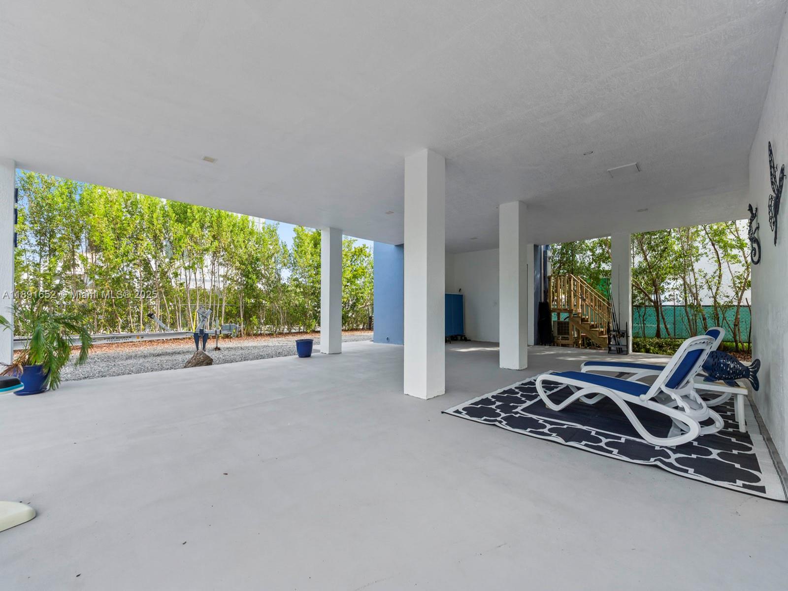 474 Bahia Honda Road Key Largo, FL 33037 - Photo 30 of 33 a very nice looking room with a large window and a fountain