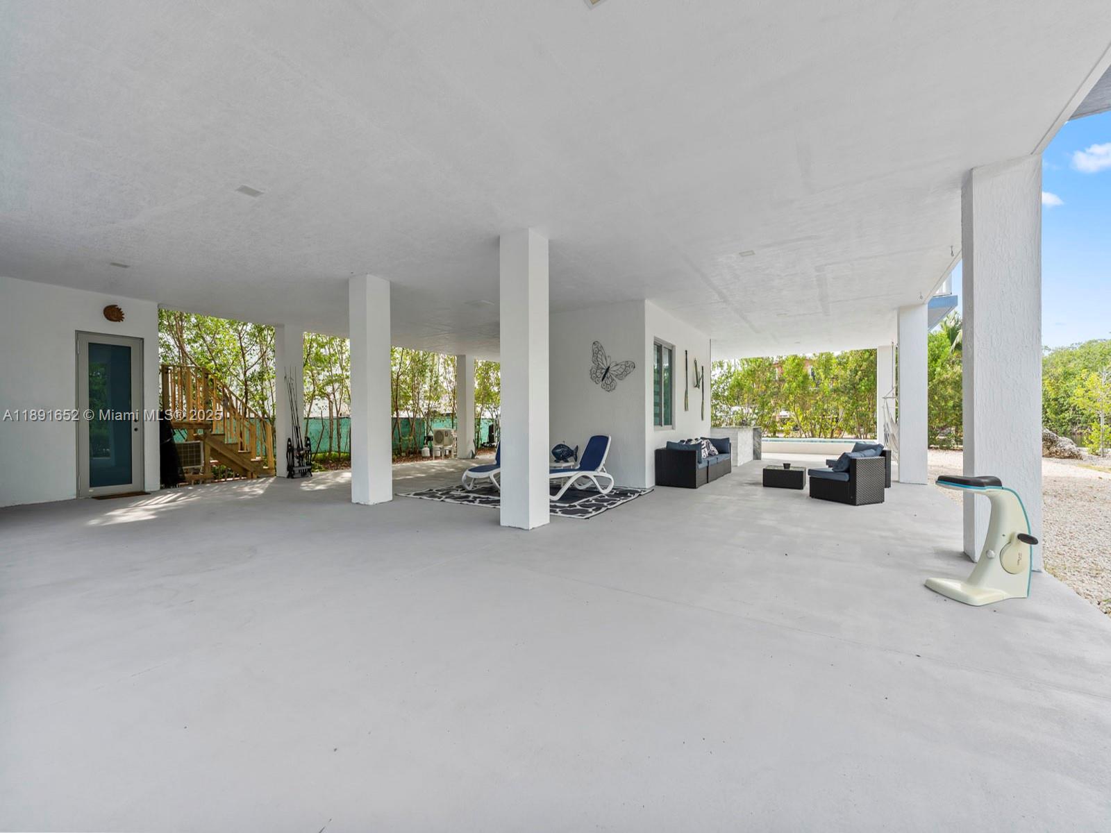 474 Bahia Honda Road Key Largo, FL 33037 - Photo 31 of 33 a living room with furniture and a large window
