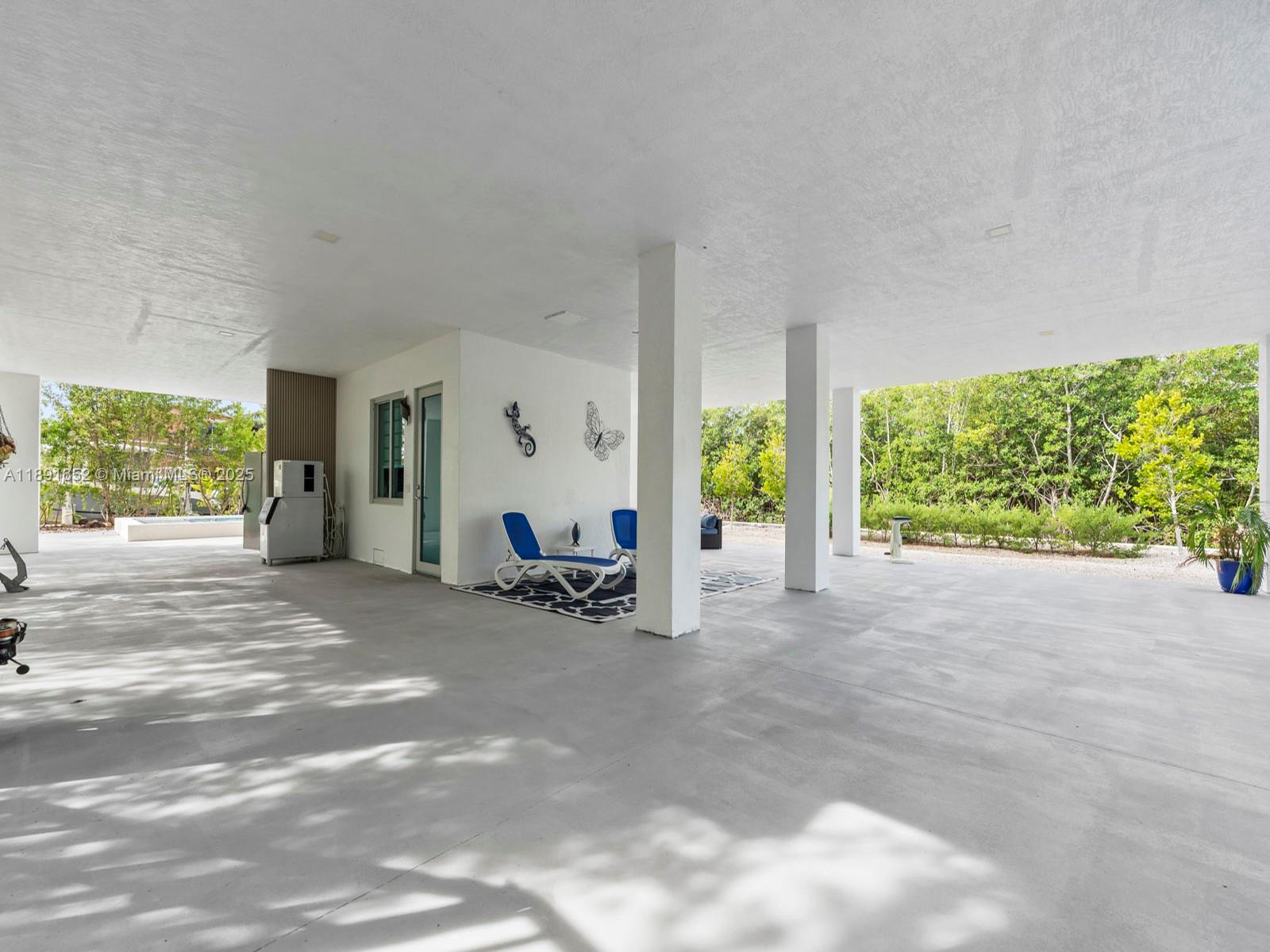 474 Bahia Honda Road Key Largo, FL 33037 - Photo 32 of 33 a view of a livingroom with a patio and a yard
