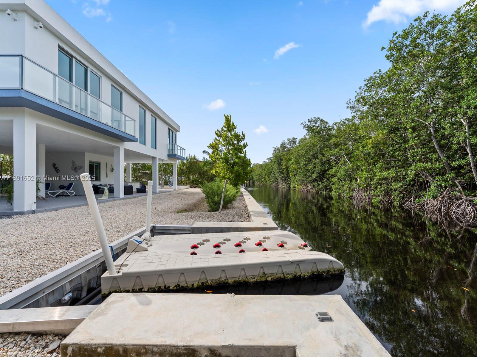 474 Bahia Honda Road Key Largo, FL 33037 - Photo 7 of 33 a view of backyard with swimming pool and outdoor seating
