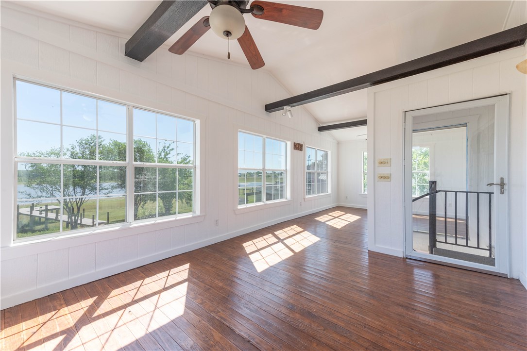 132 Zenna Drive Mathis, TX 78368 - Photo 18 of 40 a view of an entryway with wooden floor and windows