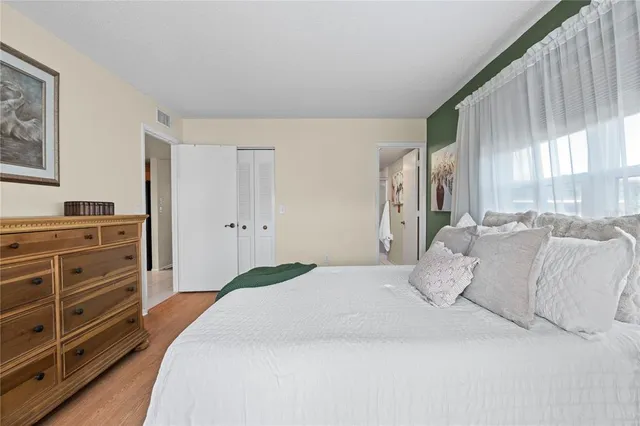 a bedroom with a bed and a dresser