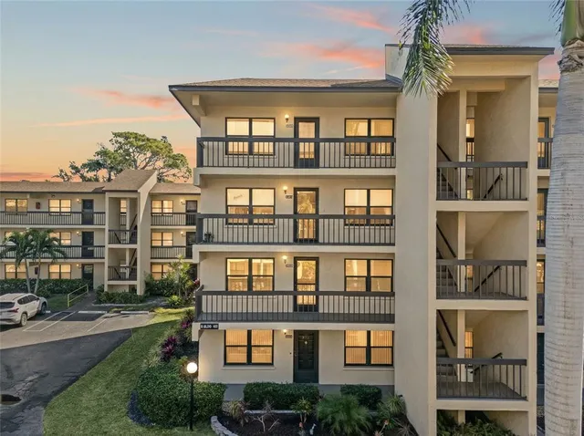 a front view of a building with a lot of windows